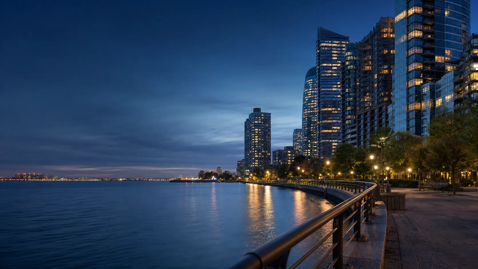 Jersey City waterfront promenade and residential skyline at blue hour